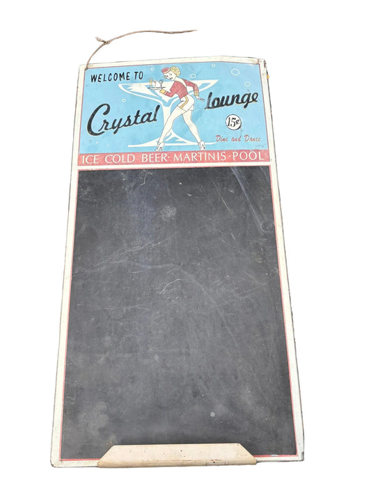 Chalkboard sign with vintage-style design on a decorative metal table