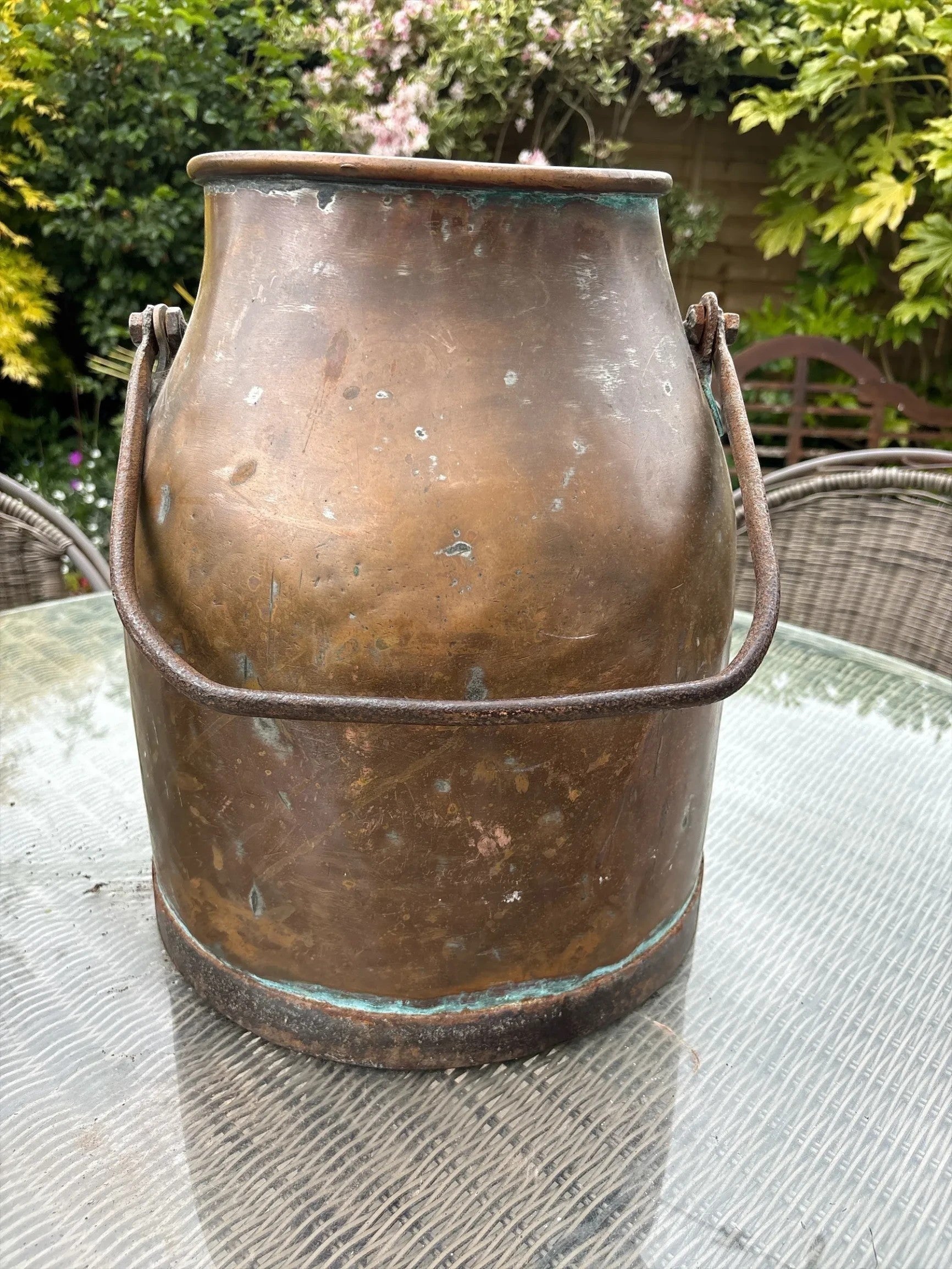 Otoch antique copper milk churn with a rustic aged patina and metal handle, ideal for rustic decor or as a planter.