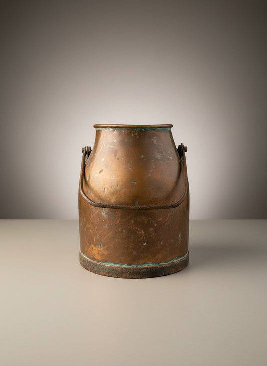 Otoch antique copper milk churn with a rustic aged patina and metal handle, ideal for rustic decor or as a planter.