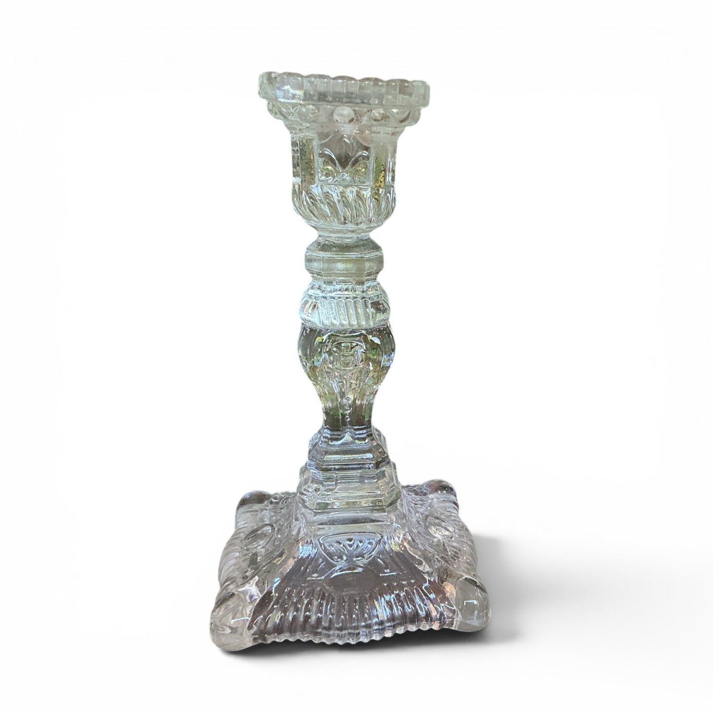 Otoch clear pressed glass candlestick holder with ornate textured detailing and a classic square base.