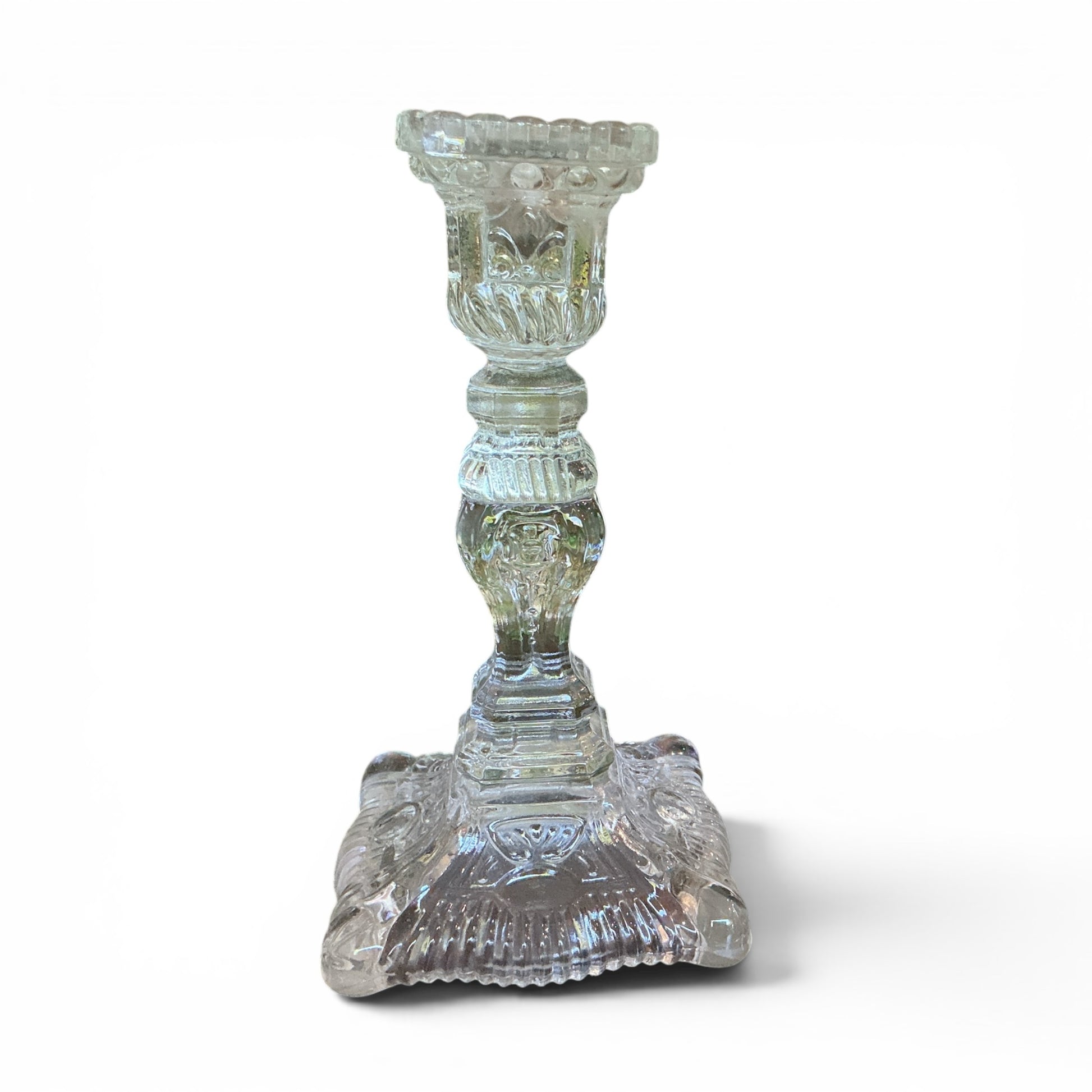 Otoch clear pressed glass candlestick holder with ornate textured detailing and a classic square base.