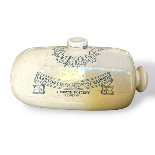 Otoch vintage Doulton Lambeth cream glazed stoneware foot warmer with Victorian scrollwork and London pottery mark.