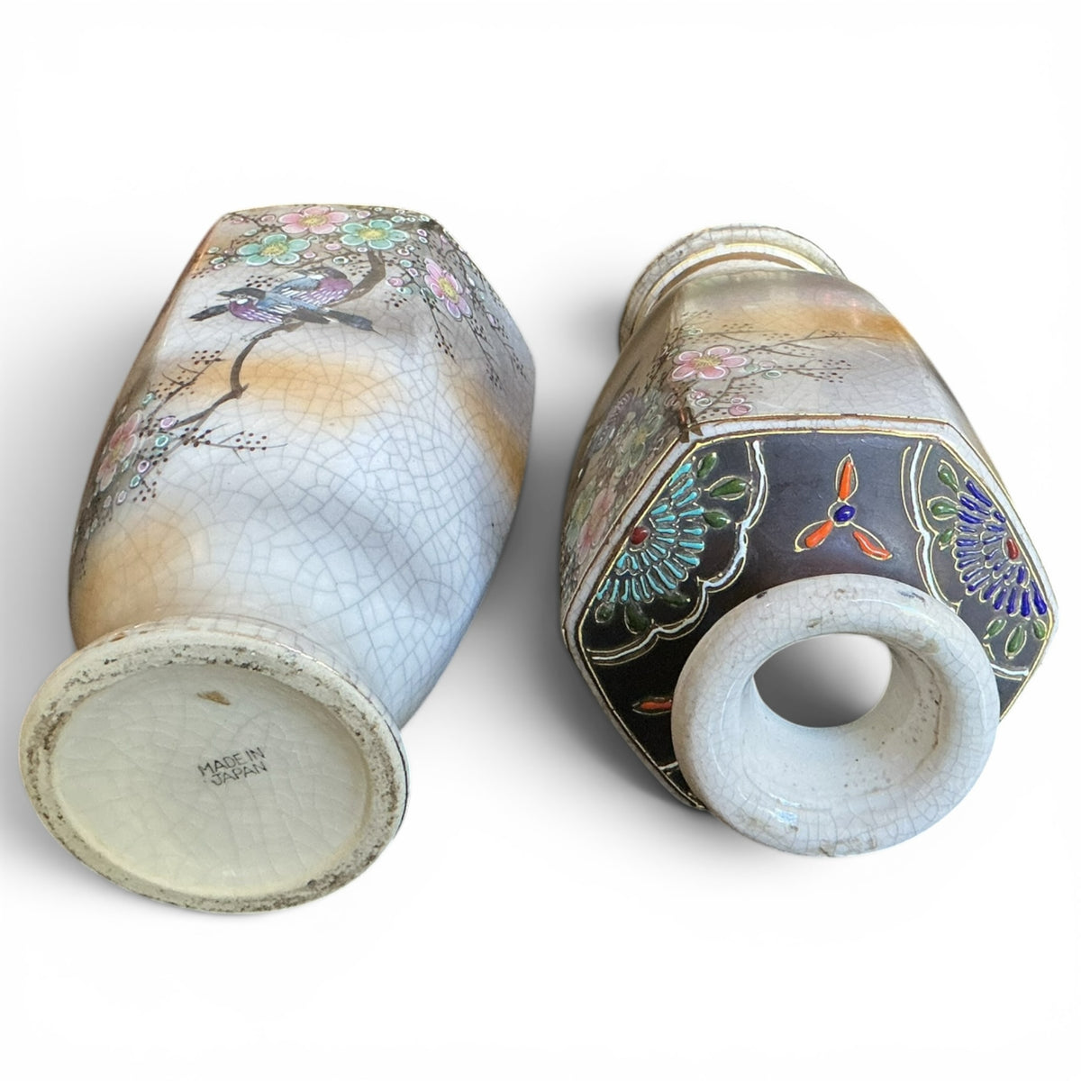 Otoch pair of hexagonal Japanese ceramic vases with crackle glaze, hand-painted bird and floral motifs, and gold accents.