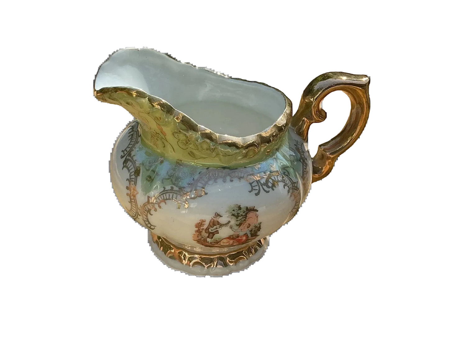Otoch porcelain creamer with gold trim and hand-painted scene, part of a vintage tea set.