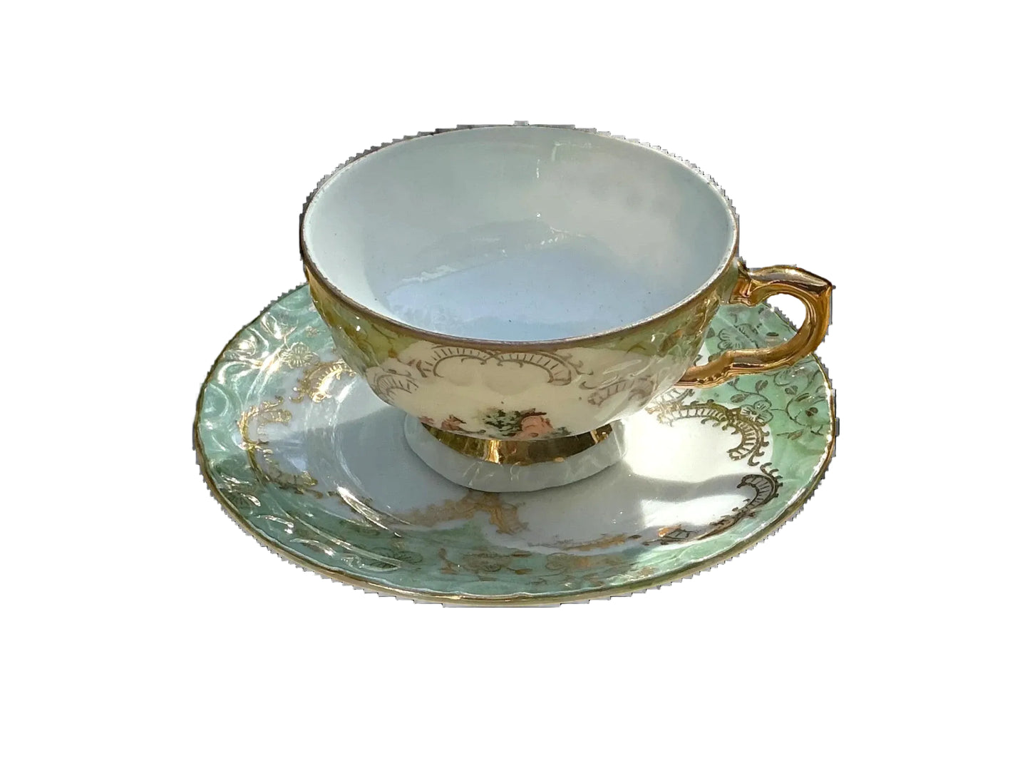 Otoch porcelain teacup and saucer with gold accents and green floral pattern. Vintage elegance for tea parties.
