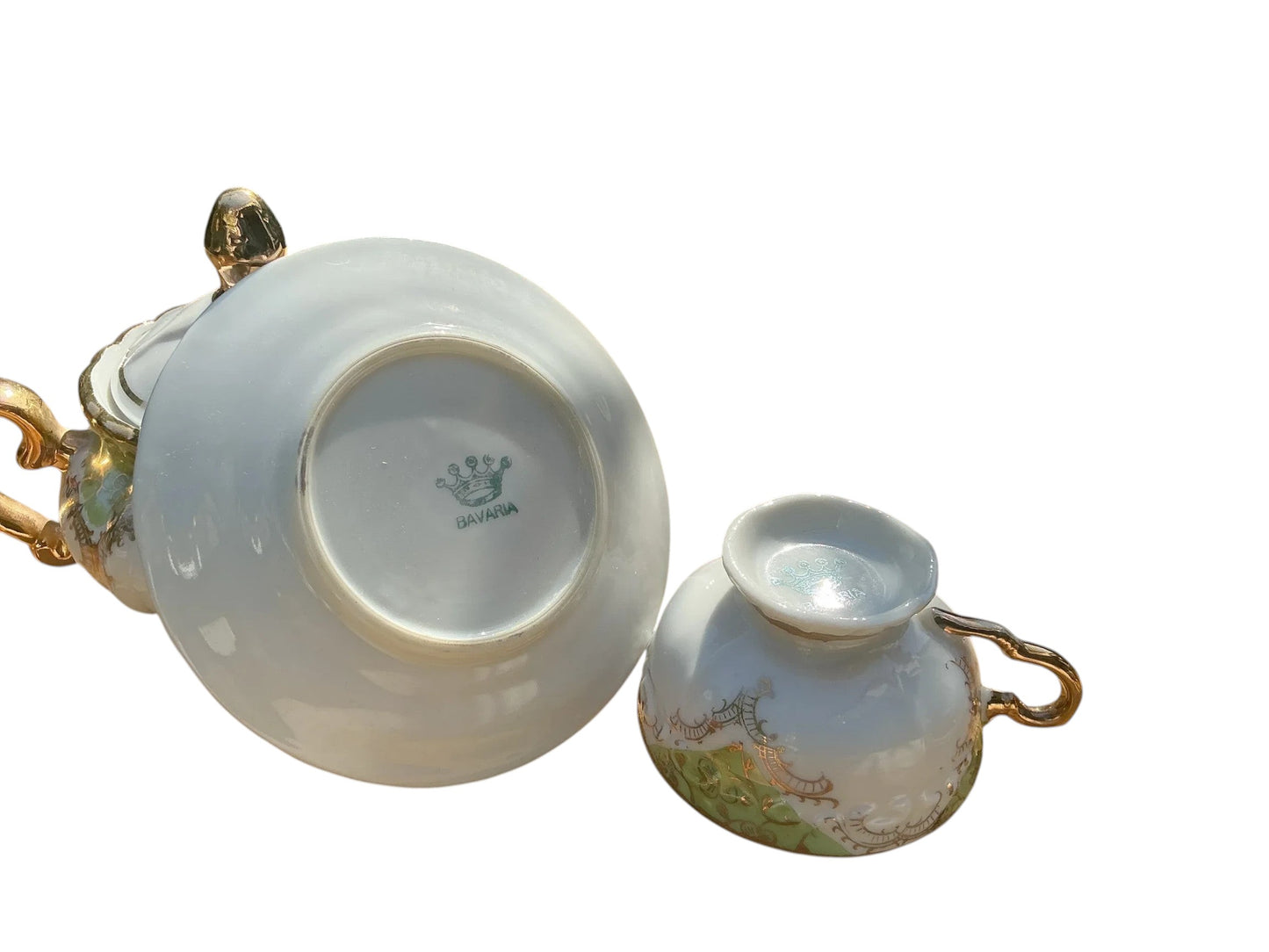 Otoch white porcelain tea cup and saucer with gold trim and green floral accents, Bavarian made.