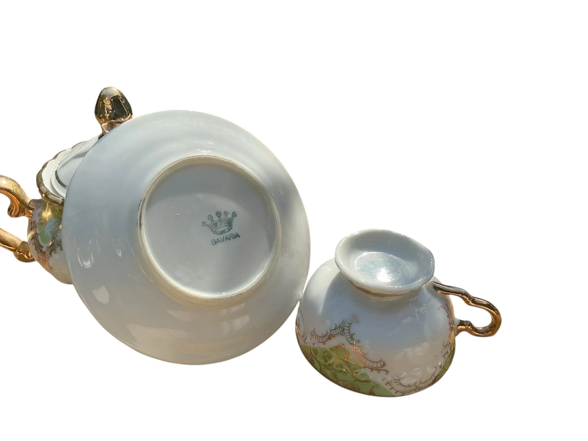 Otoch white porcelain tea cup and saucer with gold trim and green floral accents, Bavarian made.