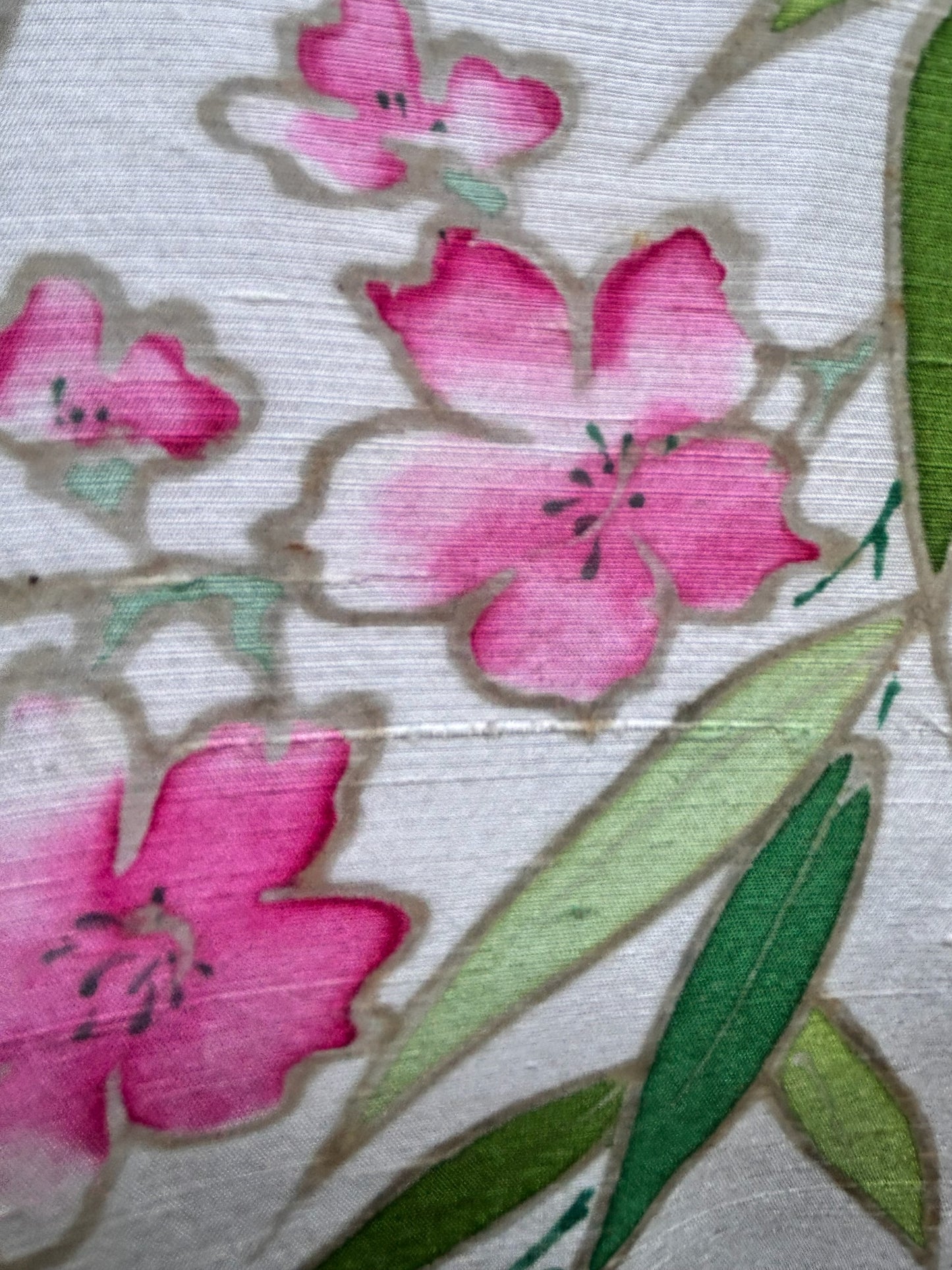 Otoch traditional Vietnamese Ao Dai silk fabric featuring hand-painted pink floral blossoms and green bamboo leaves.