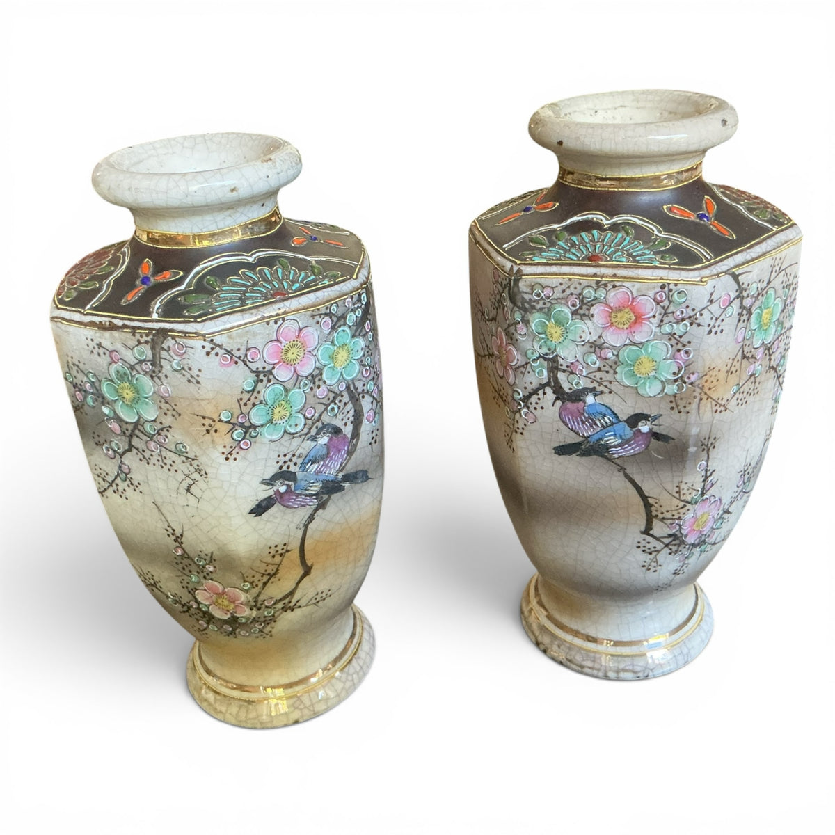 Otoch pair of vintage Japanese hexagonal ceramic vases with crackle glaze, bird and blossom motifs, and gold accents.